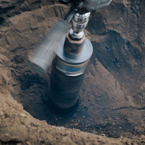 Drill drilling in soil.