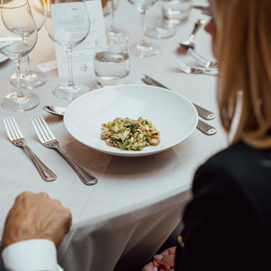 Woman about to eat a dish with barley at the EU meeting.