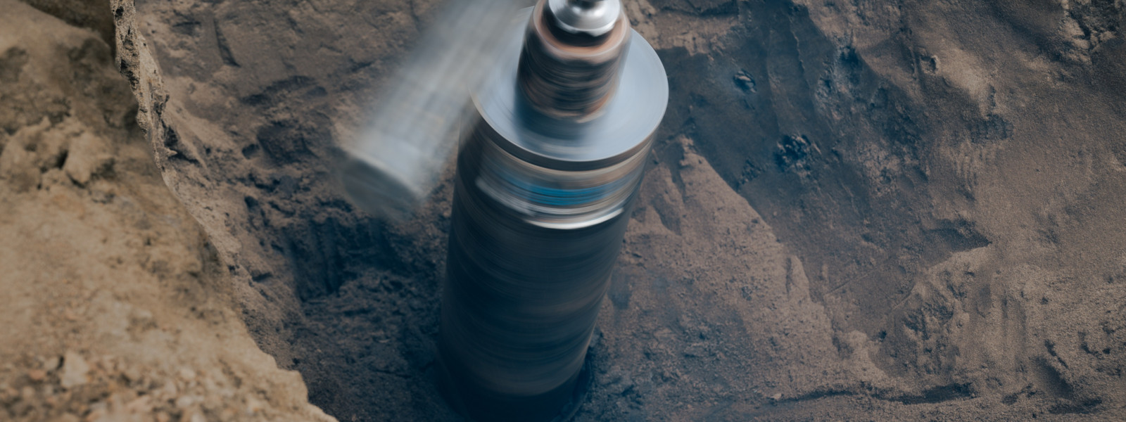Drill drilling in soil.