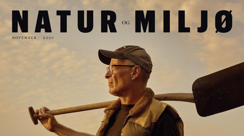 Eske Willerslev on the cover of Nature and Environment, standing in a barley field with a shovel on his shoulder.