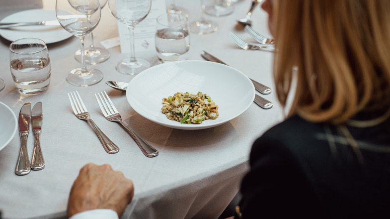 Woman about to eat a dish with barley at the EU meeting.